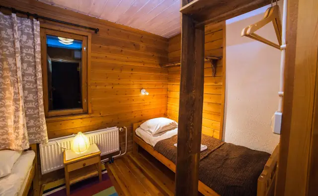 Cosy cabin bedroom at Torassieppi for the family farewell on Day 5