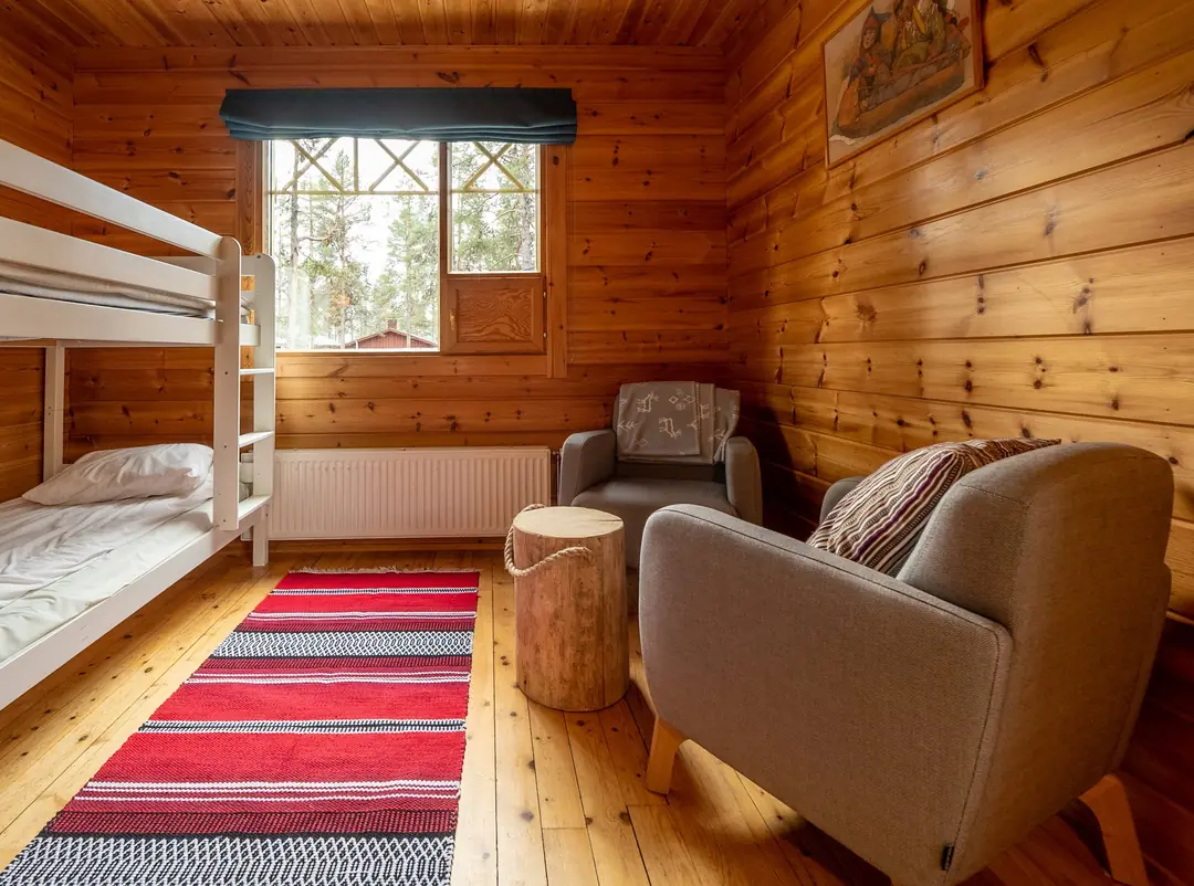 Cabin living area with bunk beds and seating